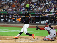 Francisco Lindor #12 of the New York Mets singles during the third inning of the baseball game against the Boston Red Sox at Citi Field in C...