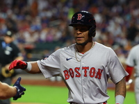 Boston Red Sox player Ceddanne Rafaela #43 is congratulated after scoring during the third inning of the baseball game against the New York...