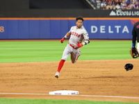 Ceddanne Rafaela #43 of the Boston Red Sox triples during the third inning of the baseball game against the New York Mets at Citi Field in C...