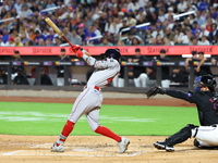 Ceddanne Rafaela #43 of the Boston Red Sox triples during the third inning of the baseball game against the New York Mets at Citi Field in C...