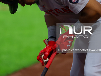 Enmanuel Valdez #47 of the Boston Red Sox prepares his bat while on deck during the second inning of the baseball game against the New York...