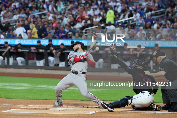 Boston Red Sox player Wilyer Abreu #52 gets out of the way of a pitch during the first inning of the baseball game against the New York Mets...