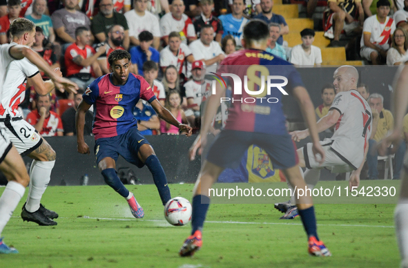 Lamine Yamal of Barcelona is in action during the La Liga match between Rayo Vallecano and FC Barcelona at Estadio de Vallecas in Madrid, Sp...