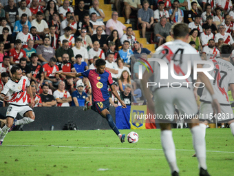 Lamine Yamal of Barcelona is in action during the La Liga match between Rayo Vallecano and FC Barcelona at Estadio de Vallecas in Madrid, Sp...