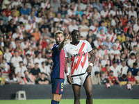 Inigo Martinez of Barcelona faces Nteka of Rayo Vallecano during the La Liga match between Rayo Vallecano and FC Barcelona at Estadio de Val...