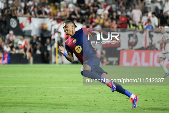 Raphinha of Barcelona is in action during the La Liga match between Rayo Vallecano and FC Barcelona at Estadio de Vallecas in Madrid, Spain,...