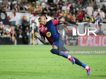 Raphinha of Barcelona is in action during the La Liga match between Rayo Vallecano and FC Barcelona at Estadio de Vallecas in Madrid, Spain,...