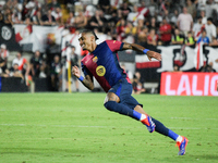 Raphinha of Barcelona is in action during the La Liga match between Rayo Vallecano and FC Barcelona at Estadio de Vallecas in Madrid, Spain,...