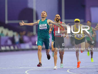 Anton Kuliatin of Neutral Paralympic Athletes celebrates winning gold in Men's 1500m - T12 Final during the Paris 2024 Paralympic Games at S...