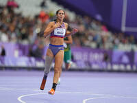 B Hatz of United States of America in action in Women's 200m - T64 Round 1 during the Paris 2024 Paralympic Games at Stade de France on Sept...