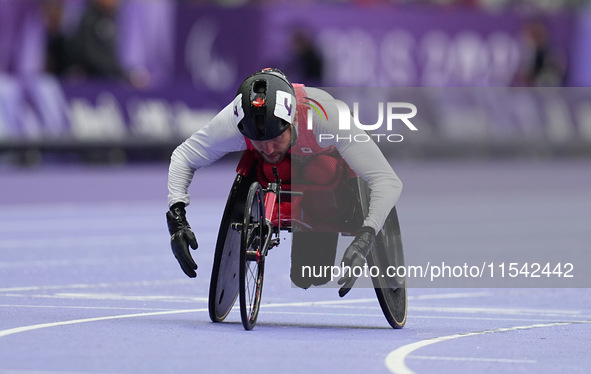 Cody Fournie of Canada celebrates winning gold in Men's 200m - T51 Final during the Paris 2024 Paralympic Games at Stade de France on Septem...