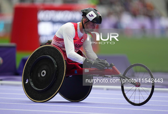 Cody Fournie of Canada celebrates winning gold in Men's 200m - T51 Final during the Paris 2024 Paralympic Games at Stade de France on Septem...