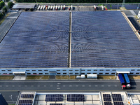 Rows of photovoltaic panels are seen on top of a New Materials company house in Haian, China, on September 3, 2024. (