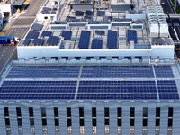 Rows of photovoltaic panels are seen on top of a New Materials company house in Haian, China, on September 3, 2024. (