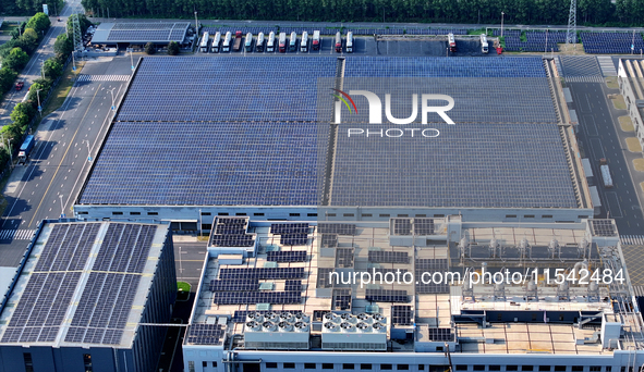 Rows of photovoltaic panels are seen on top of a New Materials company house in Haian, China, on September 3, 2024. 