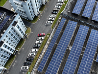 Rows of photovoltaic panels are seen on top of a New Materials company house in Haian, China, on September 3, 2024. (