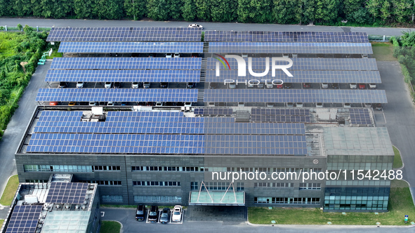 Rows of photovoltaic panels are seen on top of a New Materials company house in Haian, China, on September 3, 2024. 