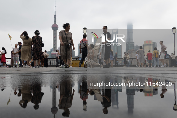 Tourists visit the Bund view platform in Shanghai, China, on September 3, 2024. 