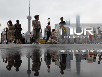 Tourists visit the Bund view platform in Shanghai, China, on September 3, 2024. (