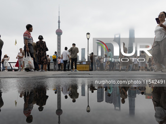 Tourists visit the Bund view platform in Shanghai, China, on September 3, 2024. (