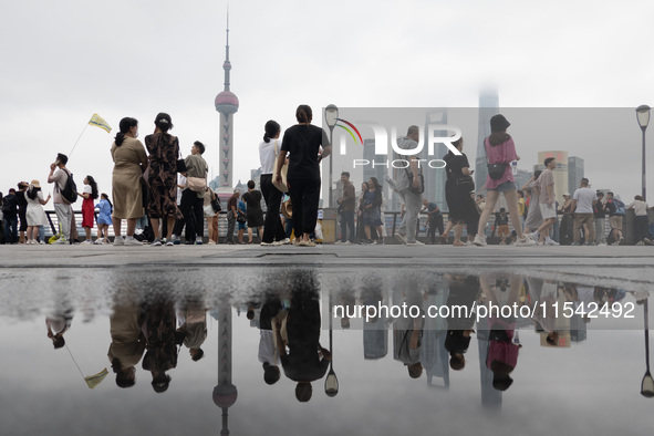 Tourists visit the Bund view platform in Shanghai, China, on September 3, 2024. 