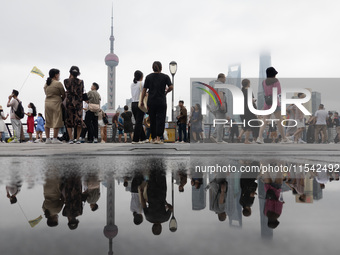 Tourists visit the Bund view platform in Shanghai, China, on September 3, 2024. (