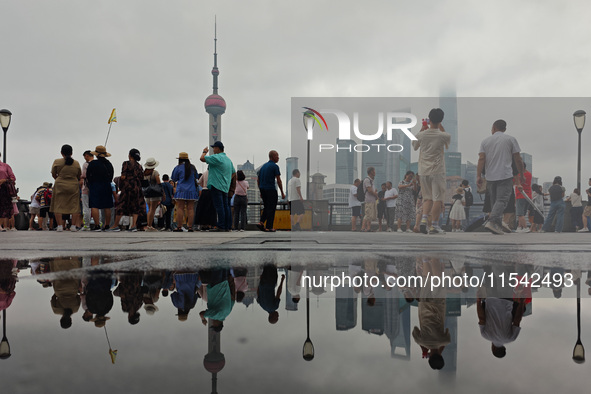 Tourists visit the Bund view platform in Shanghai, China, on September 3, 2024. 