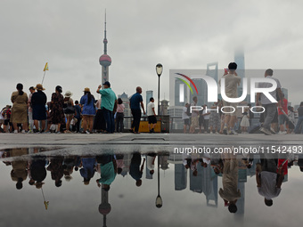 Tourists visit the Bund view platform in Shanghai, China, on September 3, 2024. (