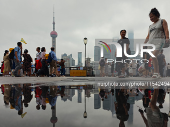 Tourists visit the Bund view platform in Shanghai, China, on September 3, 2024. (