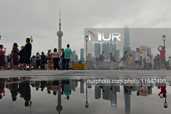 Tourists visit the Bund view platform in Shanghai, China, on September 3, 2024. 