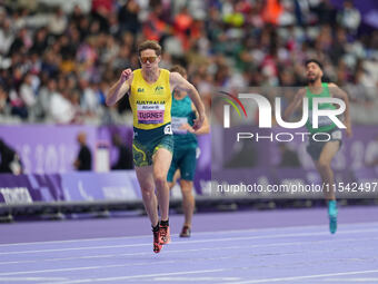 James Turner of Australia celebrates winning gold in Men's 400m - T36 Final during the Paris 2024 Paralympic Games at Stade de France on Sep...