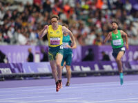 James Turner of Australia celebrates winning gold in Men's 400m - T36 Final during the Paris 2024 Paralympic Games at Stade de France on Sep...