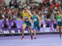 James Turner of Australia celebrates winning gold in Men's 400m - T36 Final during the Paris 2024 Paralympic Games at Stade de France on Sep...