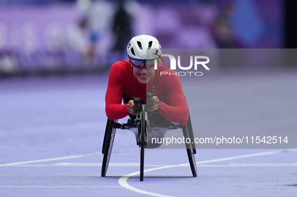 Catherine Debrunner of Switzerland celebrates winning gold in Women's 1500m - T54 Final during the Paris 2024 Paralympic Games at Stade de F...