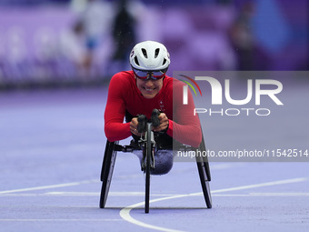 Catherine Debrunner of Switzerland celebrates winning gold in Women's 1500m - T54 Final during the Paris 2024 Paralympic Games at Stade de F...