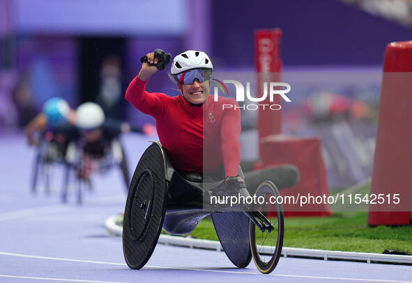 Catherine Debrunner of Switzerland celebrates winning gold in Women's 1500m - T54 Final during the Paris 2024 Paralympic Games at Stade de F...