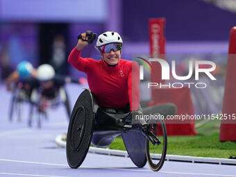 Catherine Debrunner of Switzerland celebrates winning gold in Women's 1500m - T54 Final during the Paris 2024 Paralympic Games at Stade de F...