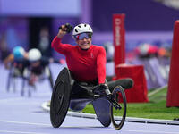 Catherine Debrunner of Switzerland celebrates winning gold in Women's 1500m - T54 Final during the Paris 2024 Paralympic Games at Stade de F...