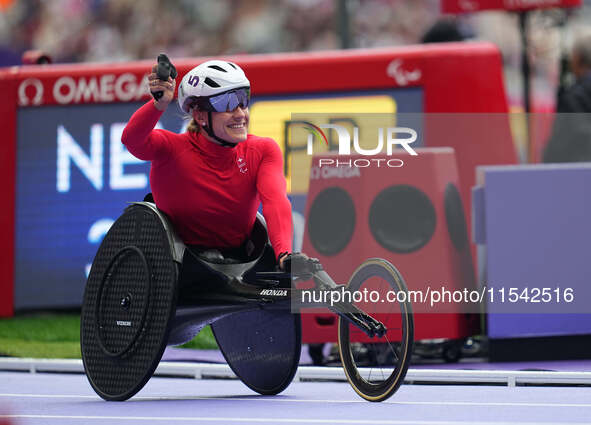 Catherine Debrunner of Switzerland celebrates winning gold in Women's 1500m - T54 Final during the Paris 2024 Paralympic Games at Stade de F...