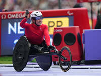 Catherine Debrunner of Switzerland celebrates winning gold in Women's 1500m - T54 Final during the Paris 2024 Paralympic Games at Stade de F...