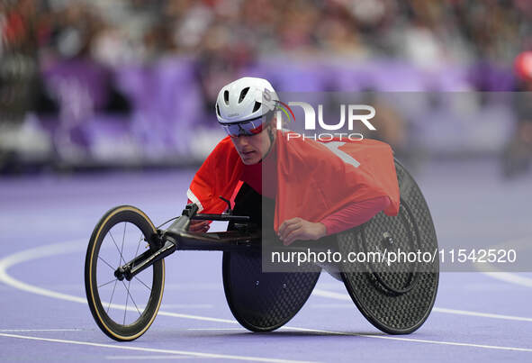 Catherine Debrunner of Switzerland celebrates winning gold in Women's 1500m - T54 Final during the Paris 2024 Paralympic Games at Stade de F...