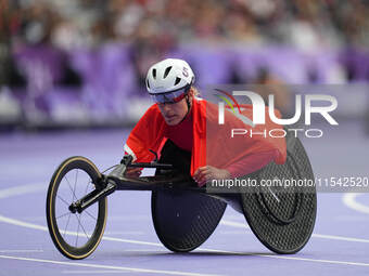 Catherine Debrunner of Switzerland celebrates winning gold in Women's 1500m - T54 Final during the Paris 2024 Paralympic Games at Stade de F...