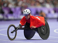 Catherine Debrunner of Switzerland celebrates winning gold in Women's 1500m - T54 Final during the Paris 2024 Paralympic Games at Stade de F...