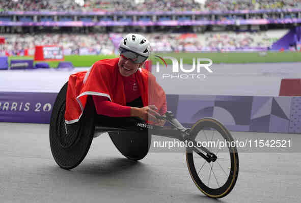 Catherine Debrunner of Switzerland celebrates winning gold in Women's 1500m - T54 Final during the Paris 2024 Paralympic Games at Stade de F...