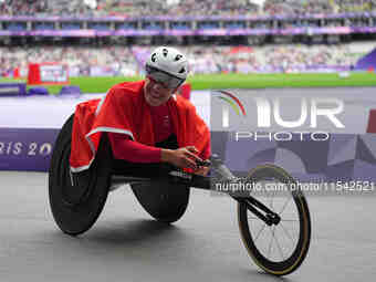 Catherine Debrunner of Switzerland celebrates winning gold in Women's 1500m - T54 Final during the Paris 2024 Paralympic Games at Stade de F...