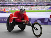 Catherine Debrunner of Switzerland celebrates winning gold in Women's 1500m - T54 Final during the Paris 2024 Paralympic Games at Stade de F...