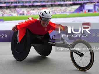 Catherine Debrunner of Switzerland celebrates winning gold in Women's 1500m - T54 Final during the Paris 2024 Paralympic Games at Stade de F...