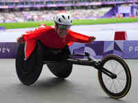 Catherine Debrunner of Switzerland celebrates winning gold in Women's 1500m - T54 Final during the Paris 2024 Paralympic Games at Stade de F...