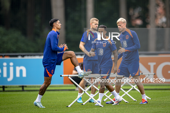 Netherlands player Tijjani Reijnders, Netherlands player Justin Kluivert, and Netherlands player Jan Paul van Hecke during the training and...