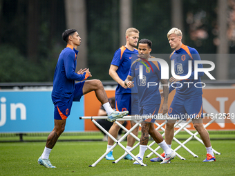 Netherlands player Tijjani Reijnders, Netherlands player Justin Kluivert, and Netherlands player Jan Paul van Hecke during the training and...